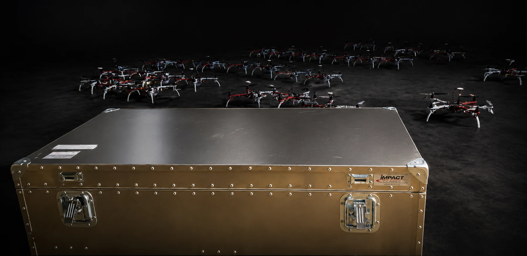 ConQuest aluminum single lid case in the field with a fleet of drones staged behind it