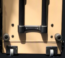 Edge caster wheel assembly mounted along the bottom edge of a Target case