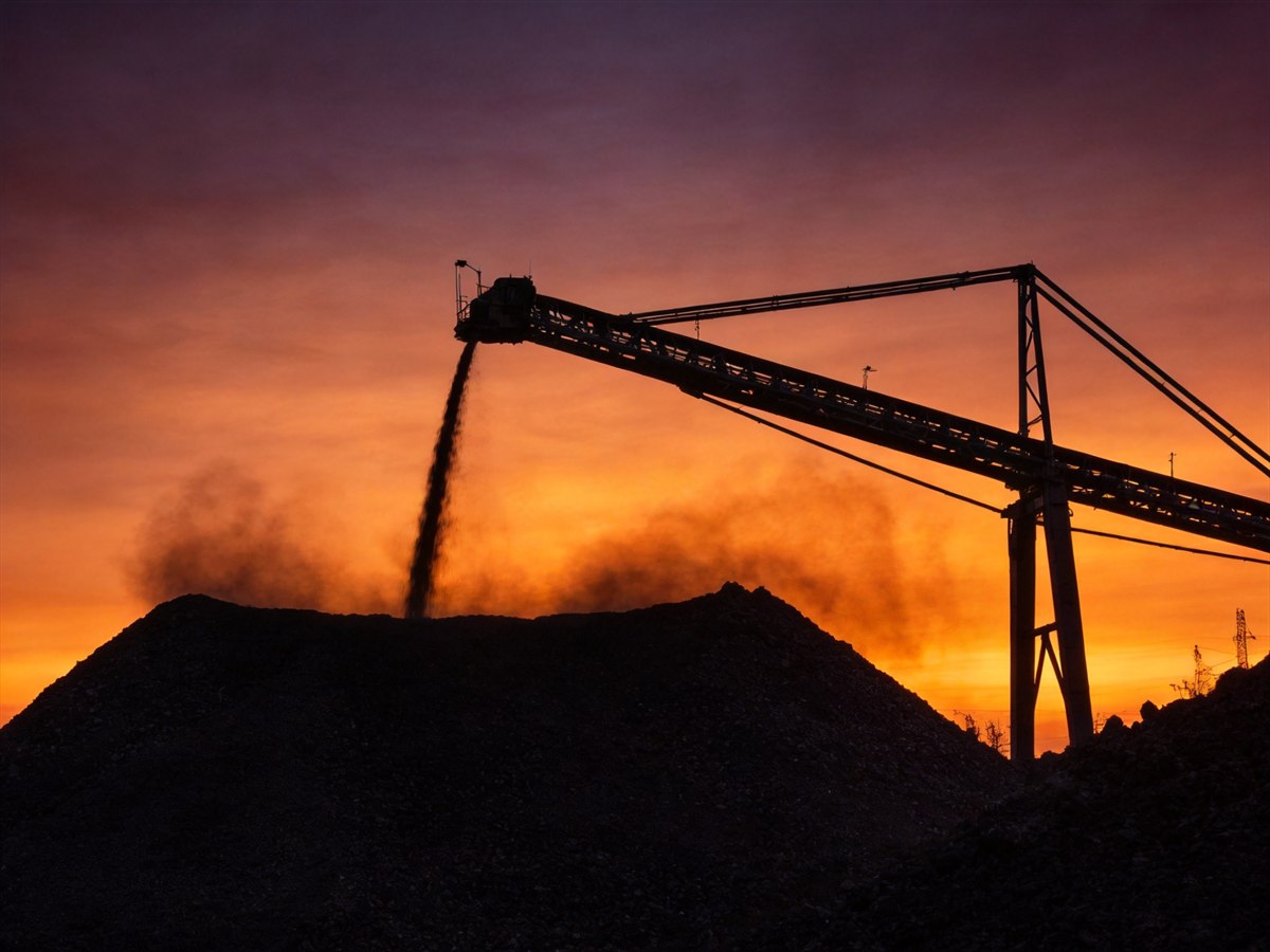 Mining conveyor crane at dusk